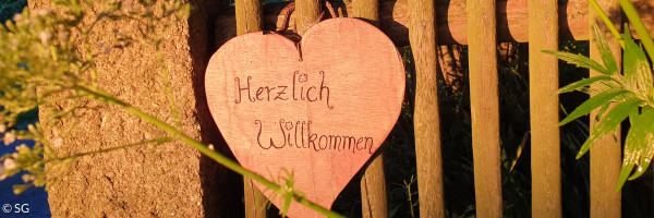 Schild "Herzlich willkommen!"